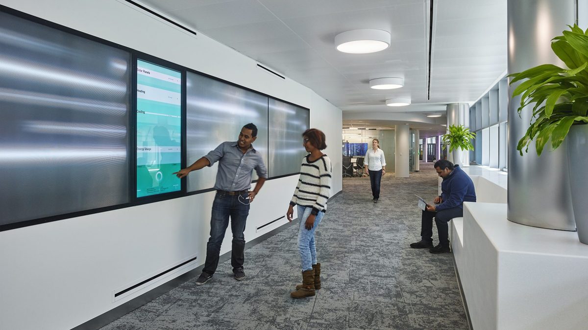 Digital display inside Unisphere corporate space, highlighting how behavior impacts energy uses.
